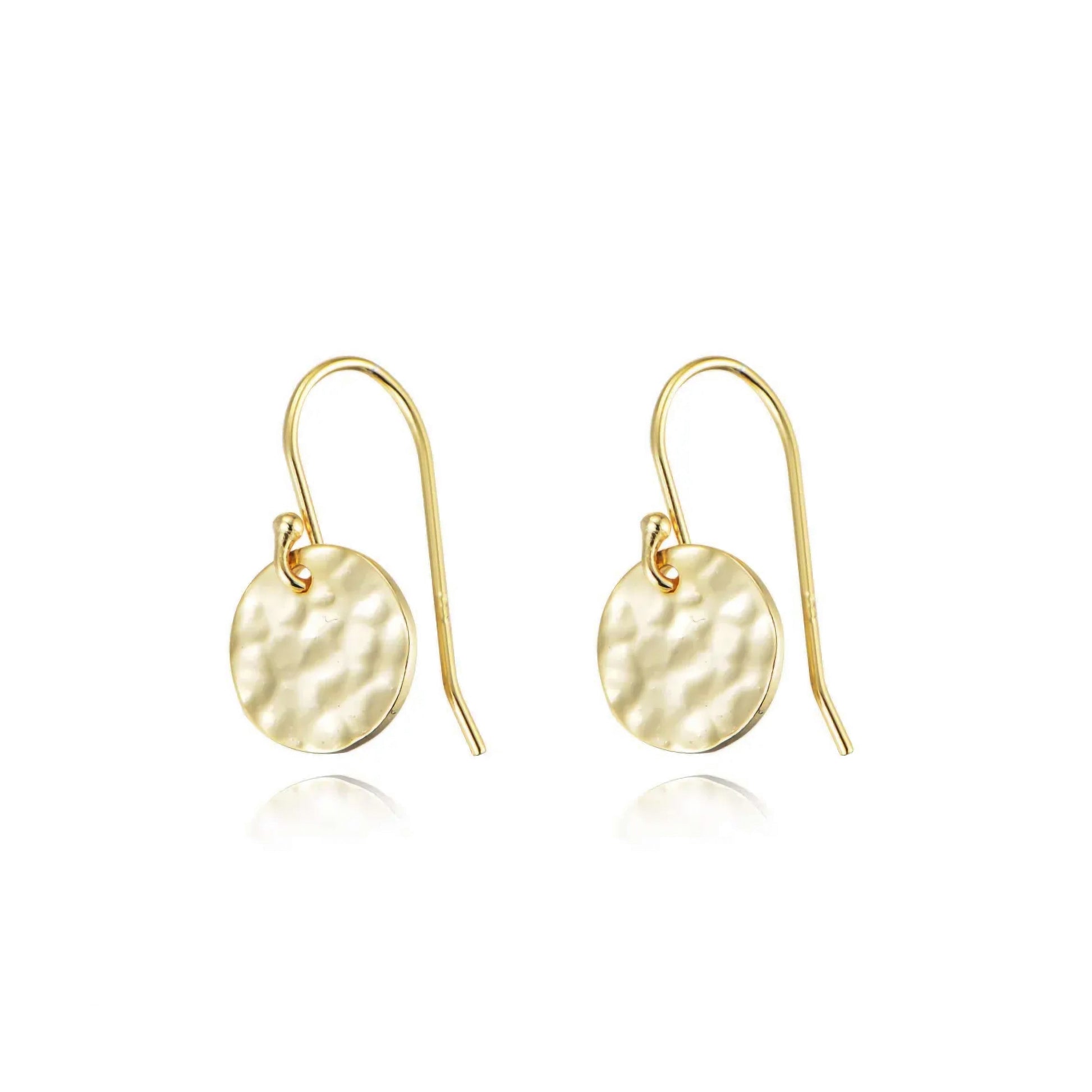 Gold earrings with round hammered design on a white background