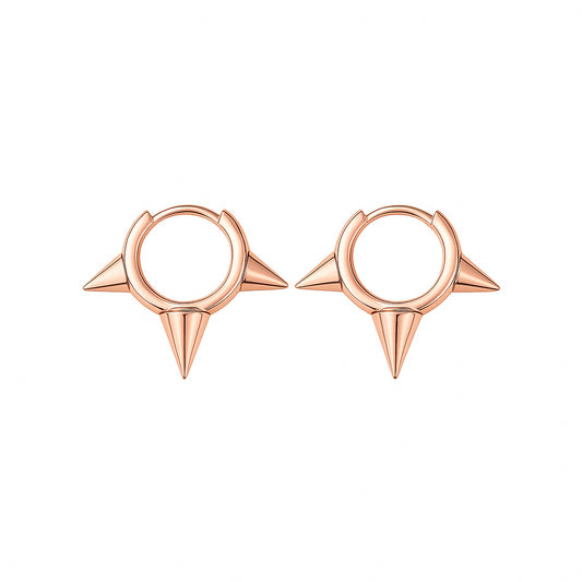 Rose gold hoop earrings with spike designs on a white background