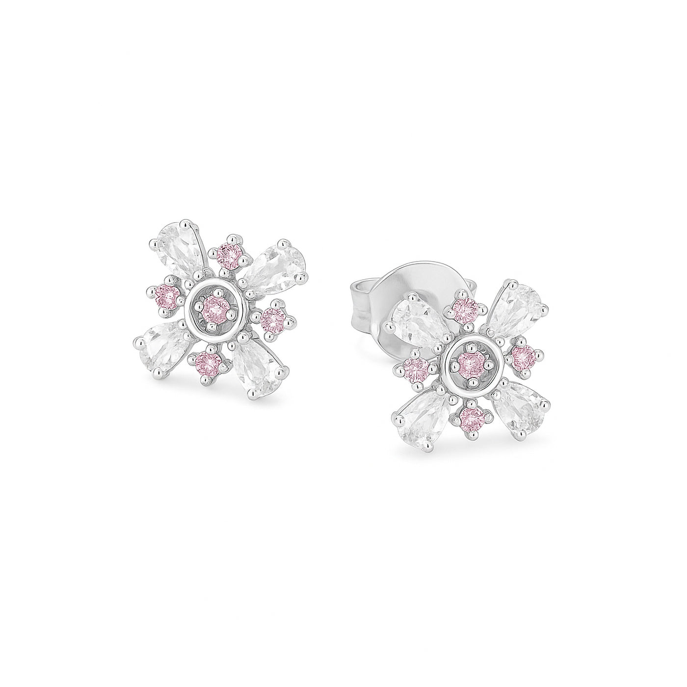 Pair of silver earrings with pink gemstones on a white background — jewellery detail
