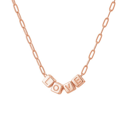 Rose gold necklace with 'LOVE' pendant on a white background
